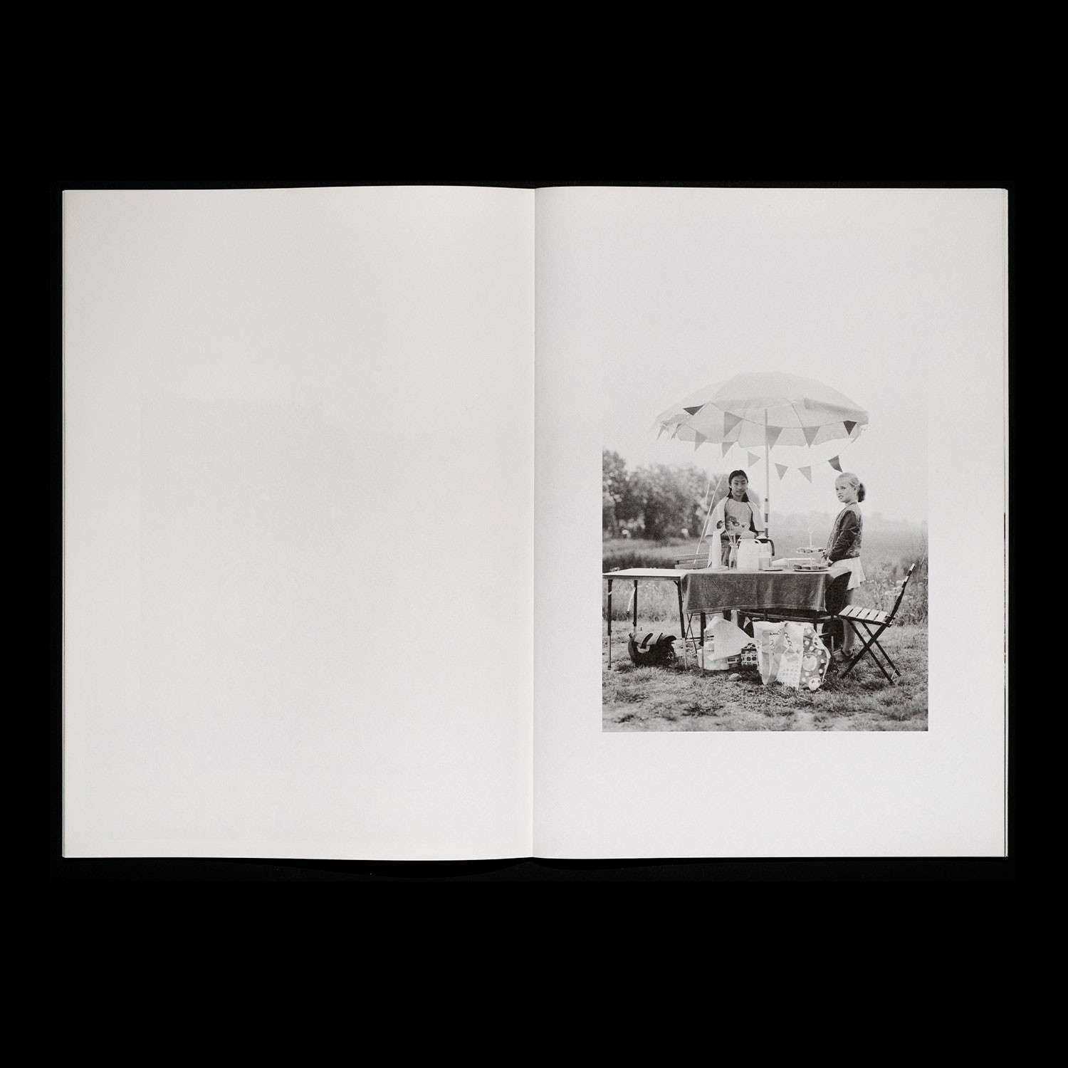 spread with a photo of two girls under a sunshade